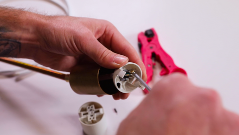 A man wiring a socket