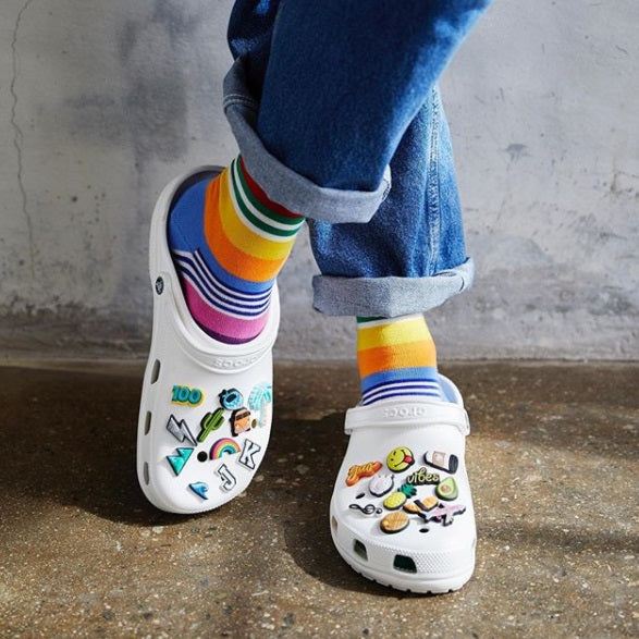 Crocs Jibbitz with multicolored socks.