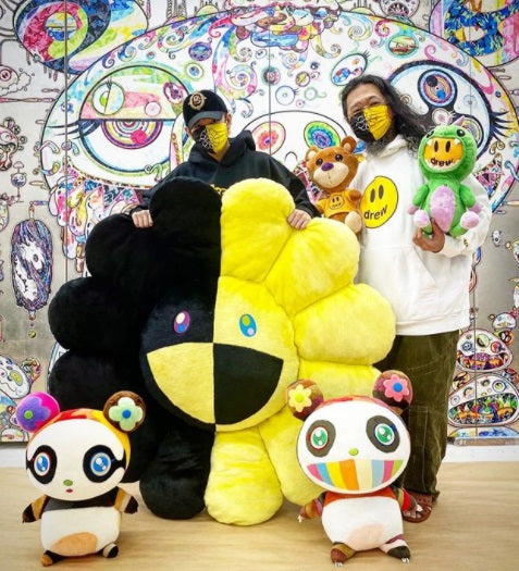 Takashi Murakami with flower stuffed toy and Drew clothing.