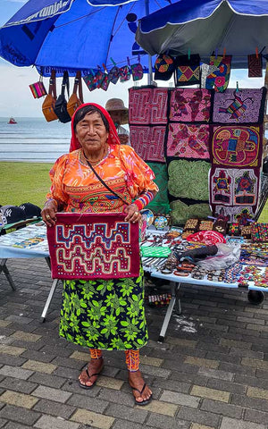 Guna woman selling molas at the Panama City waterfront