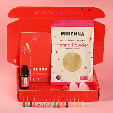 The product display of a henna powder kit containing a henna powder pack, applicator bottles, and other essentials.