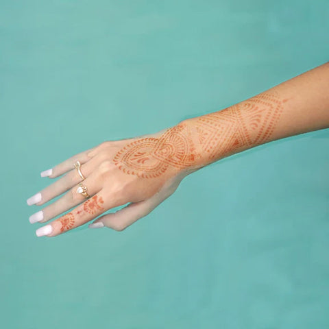 A photo of Zena henna design on arm after henna application.