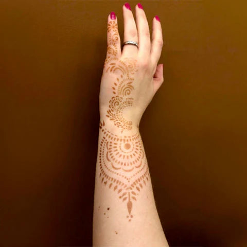 Henna tattoo design on back of hand and wrist