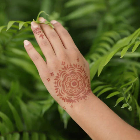 Henna ink tattoo on back of hand