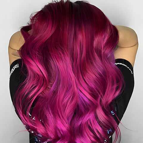 A pretty woman flaunting her wavy hair in magenta hair color.