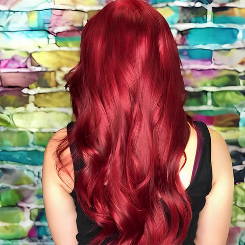 A woman with her back turned, showcasing long red velvet hair.