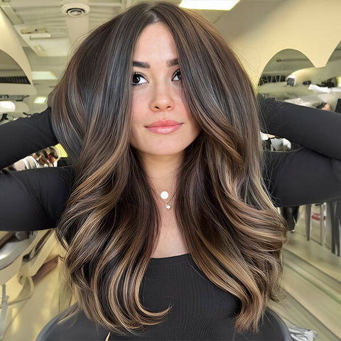 A pretty woman is flaunting her hair in a brunette balayage hair color.