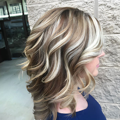 Stylish wavy hair featuring blonde mocha hair shade
