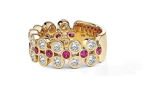 A ruby and diamond fashion ring crafted in yellow gold.