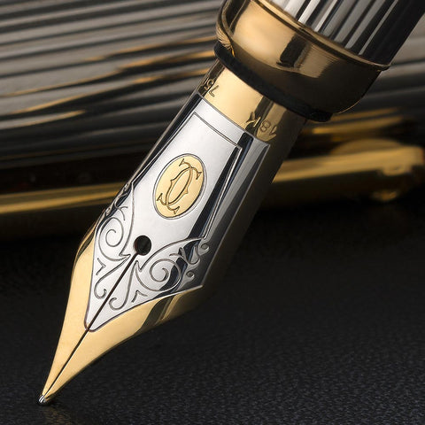 A gold nibbed fountain pen