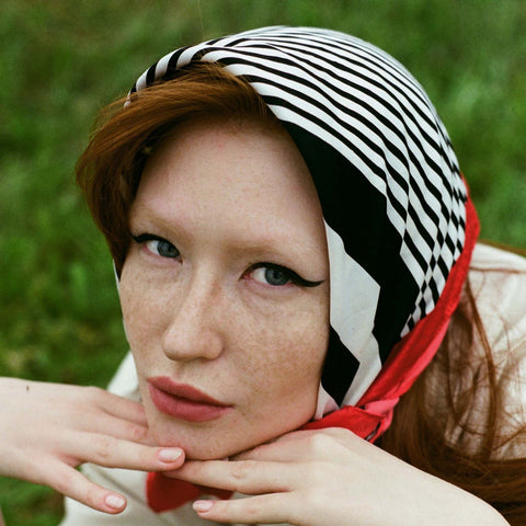 Woman wearing striped head scarf