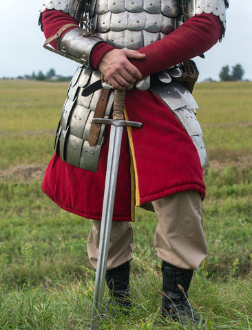 Medieval soldier standing in a field