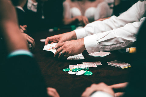 A dealer in poker handing out cards.