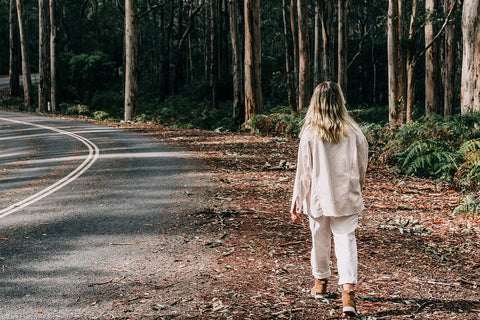 women-walking-in-road-amongst-trees