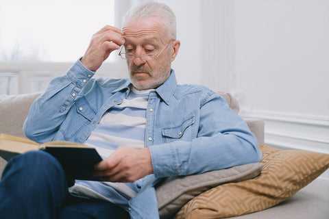 Man reading on the couch.