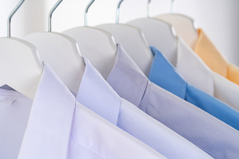 Multiple pastel coloured shirts on hangers, credit to sorapong-chaipanya on pexels