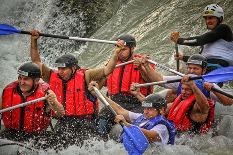 Group of guys white-river rafting