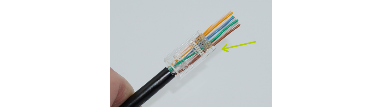 Push the conductors into the plug so they come out the nose. Don’t fully seat the cable yet. Check the color sequence again.