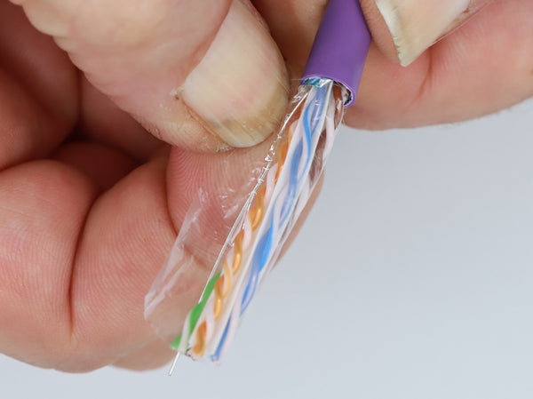 removing the polyester tape from the shielded cabling