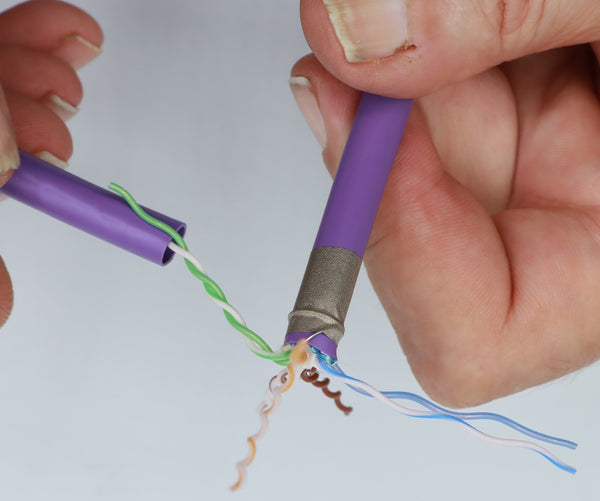 Use the piece of cable jacket you stripped off to untwist the conductor pairs