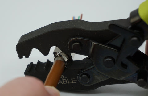 Place the assembly into the “large” collar crimp cavity on the ground crimp tool