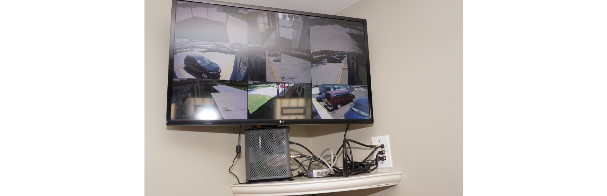 Remote part of the installation showing keystone jacks, network switch, cable modem, and live view monitoring of network cameras