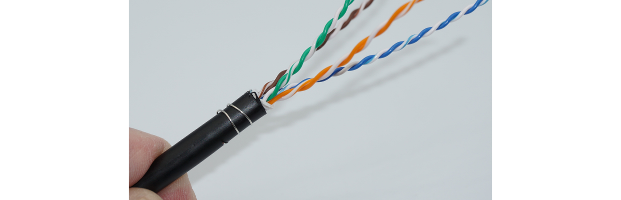 Wrap the ESD drain wire around the cable jacket in a spiral fashion