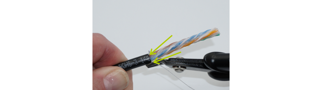 Flush cut the rip cord off. Check for nicks in the conductors near the cable jacket edge.