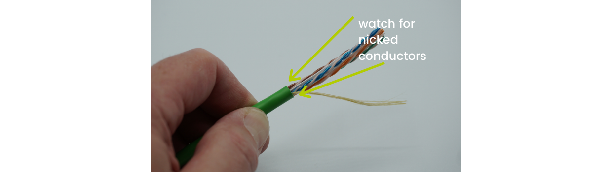 Inspect for conductor nicks at the cable jacket edge.