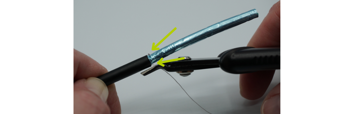 Remove the nylon ripcord. Check for slices in the cable shield near the cable jacket edge. If you see any, you may have nicked a conductor. Keep your eyes open!