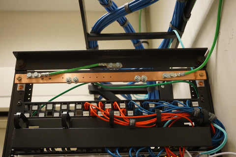 The cable drops down from the ladder rack and terminates to the back of the rack mounted patch panel.