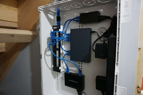 a photo of structured media enclosure and a patch panel