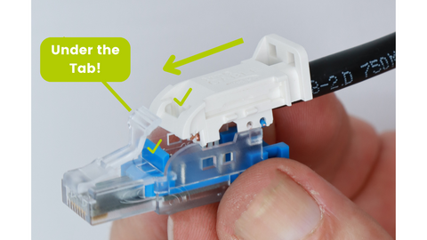 Carefully insert the cap into the housing. Insert the cap at a shallow angle to clear the clear plastic locking tab. Align the blue post slot with the slot cut-out in the conductor holder cap.