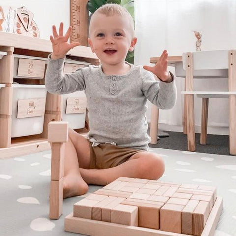 Child-building-with-wooden-blocks