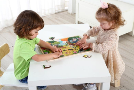 children working on a puzzle together