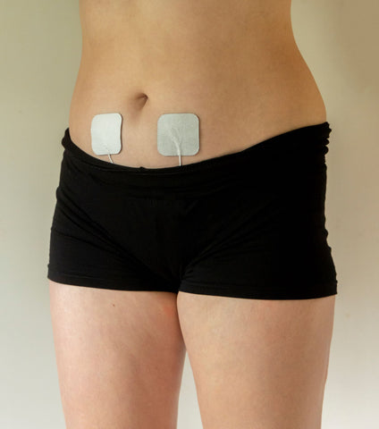 TENS unit electrode pad placement on abdomen for menstrual cramp pain 