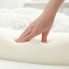 Hand pushing into memory foam