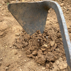 Korean Homi garden hand hoe digging into soil