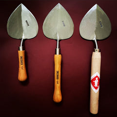 Three Sneeboer Old Dutch Style Planting Trowel in a row showing three different handles, short cherry, long cherry and long ash handle