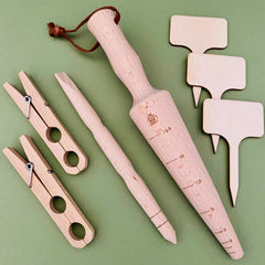 A selection of eco friendly wooden garden tools - dibber, pricking stick, labels and plant ties 