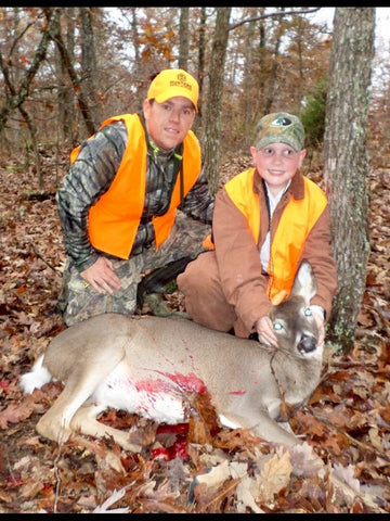 Father and Son with a deer.