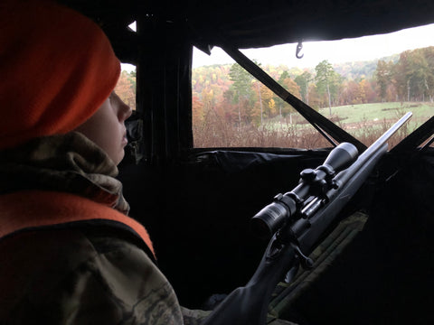 Youth hunting from a blind