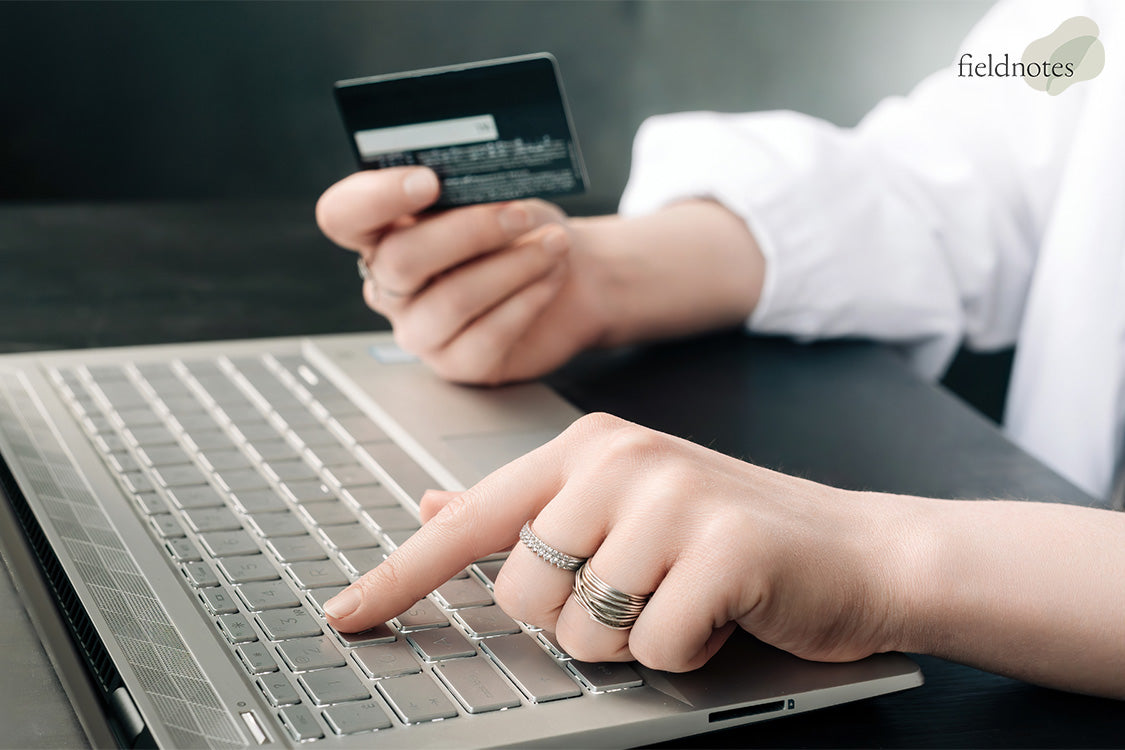 A Person Making A Purchase Online With Their Credit Card