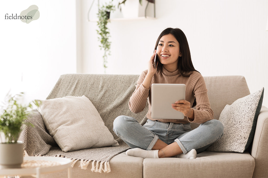 A Phone Call While Sitting On A Sofa At Home