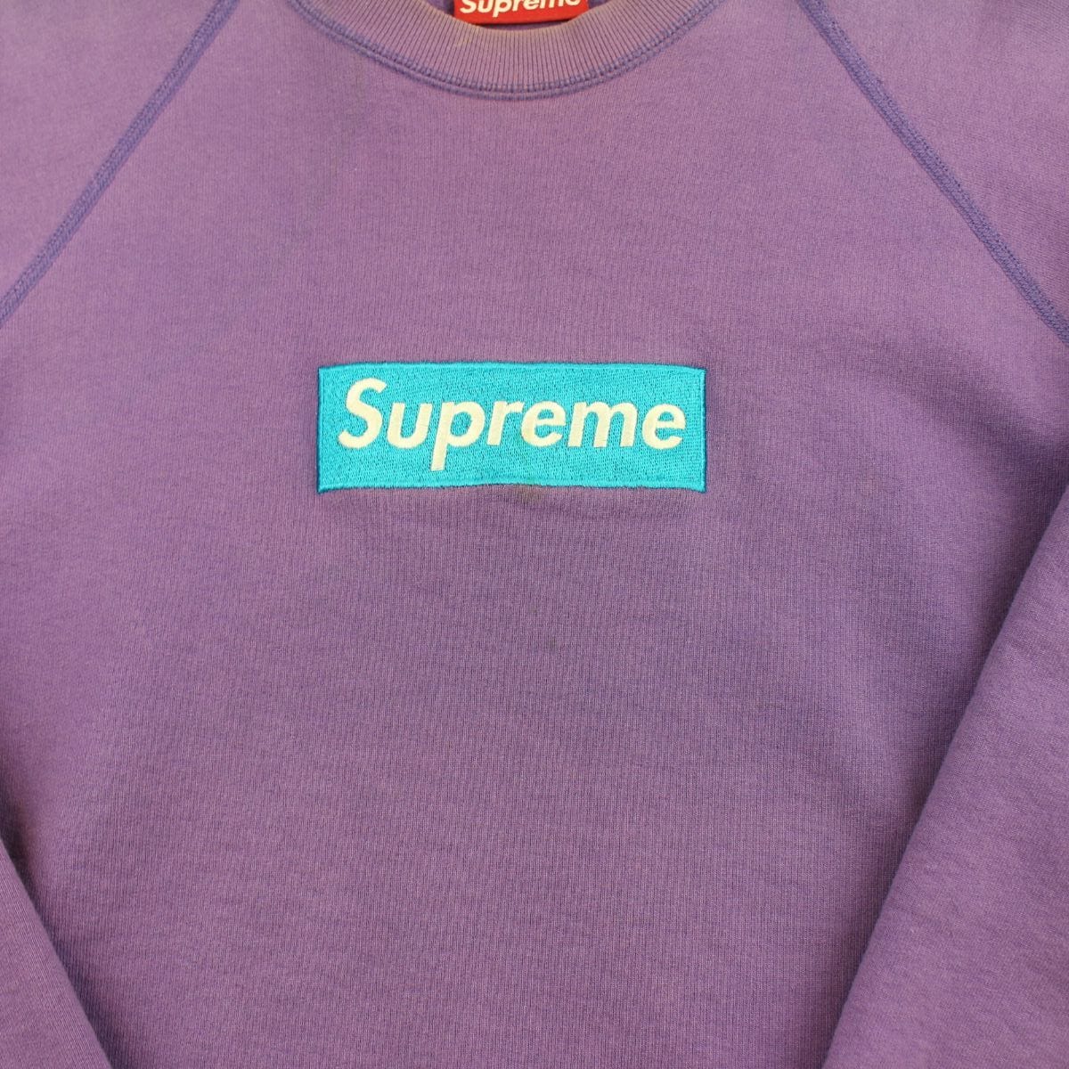 teal on purple box logo