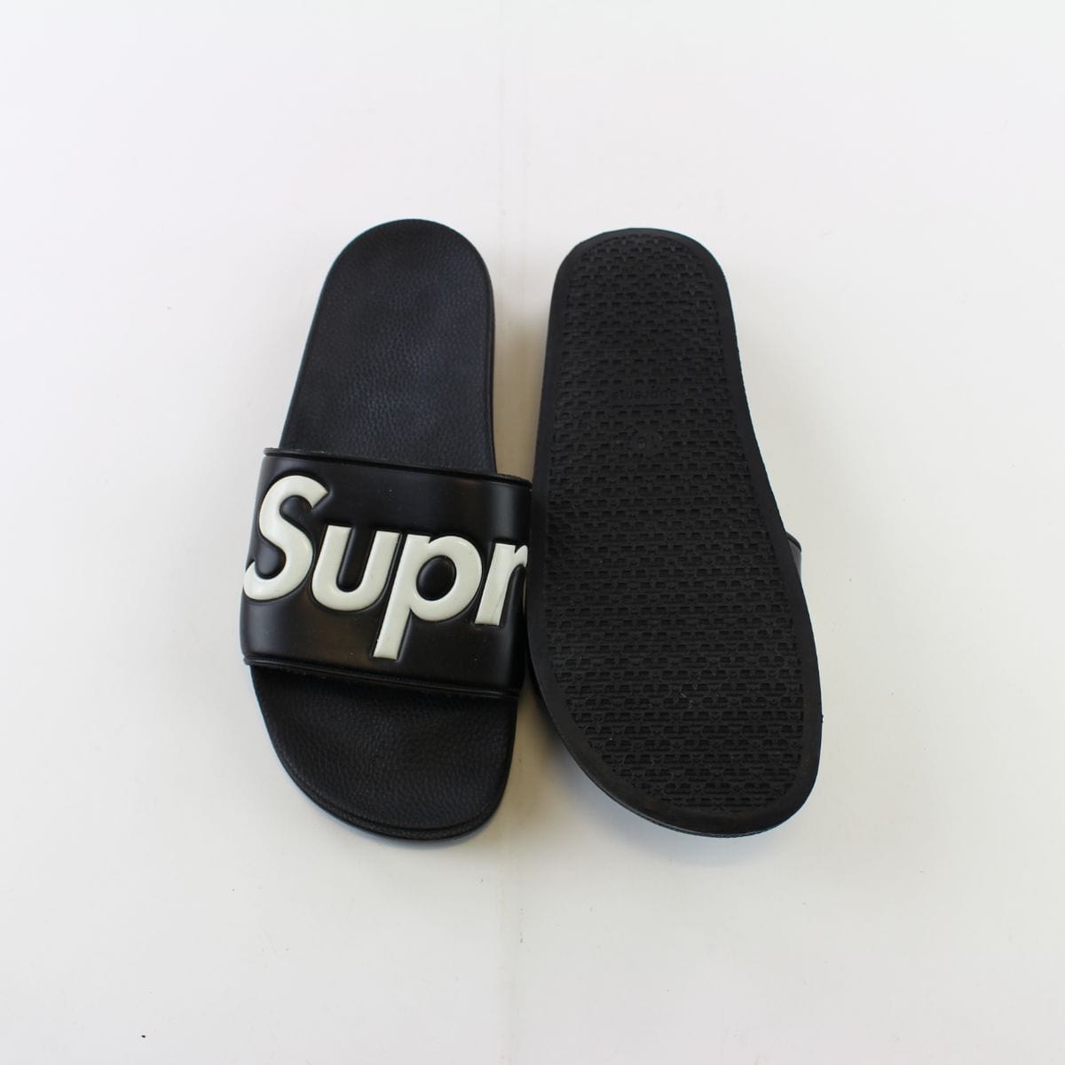 supreme flip flops black