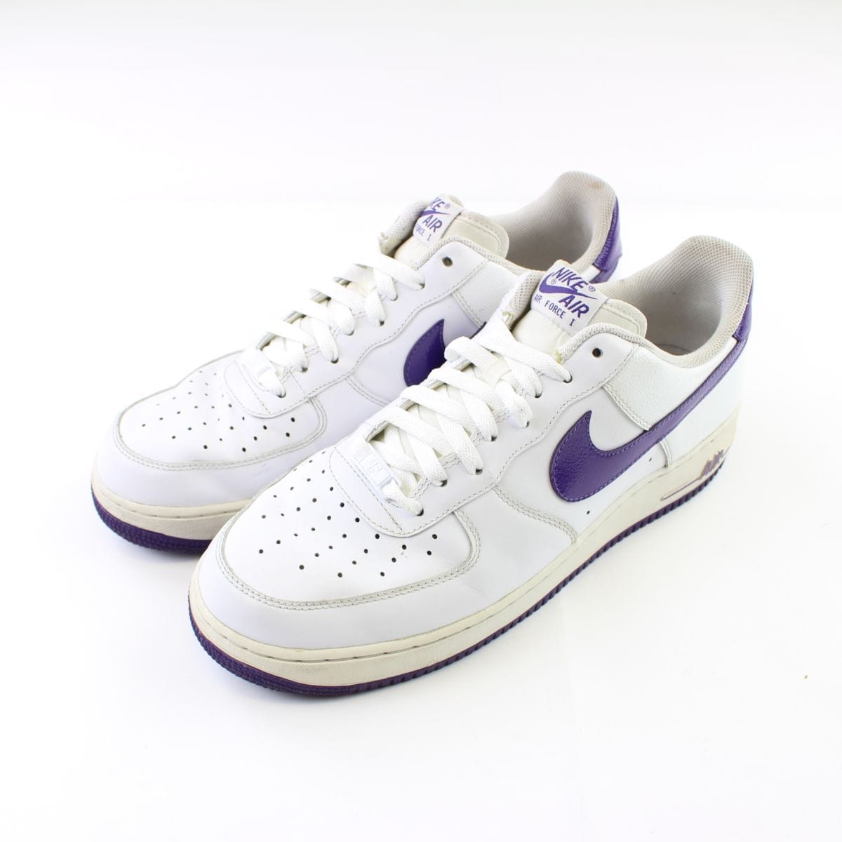 white nike shoes with purple swoosh