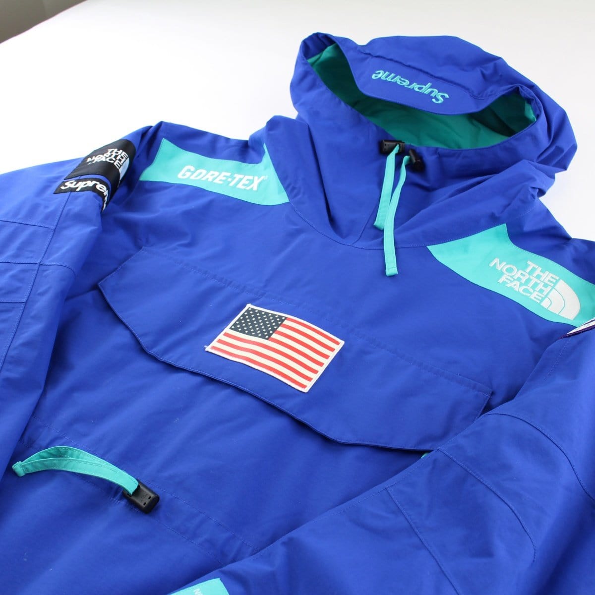 blue north face supreme jacket