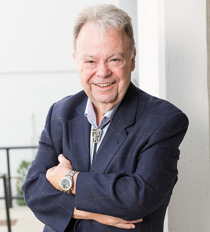 Bill Ross of Ross Organic in a blue blazer with bolo tie