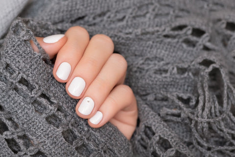 What does it mean when a girl paints her nails white